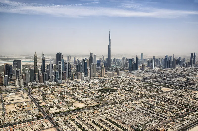 Aerial view of the Dubai skyline with the Burj Khalifa rising above the city